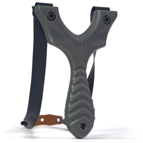 Ergonomic Y-shaped slingshot with a ribbed gray grip, black elastic bands, and a brown leather wrist strap in the background.] ,"text" :"